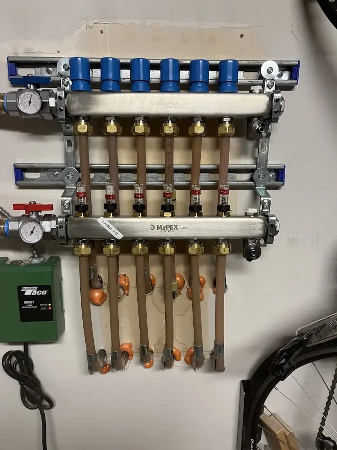 Plumber performing Water Heater Repair at a residential property in Sherrelwood